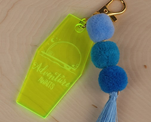 ADVENTURE AWAITS KEYCHAIN