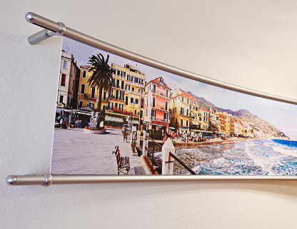 Curved panoramic structural banner frames mounted onto a wall surface